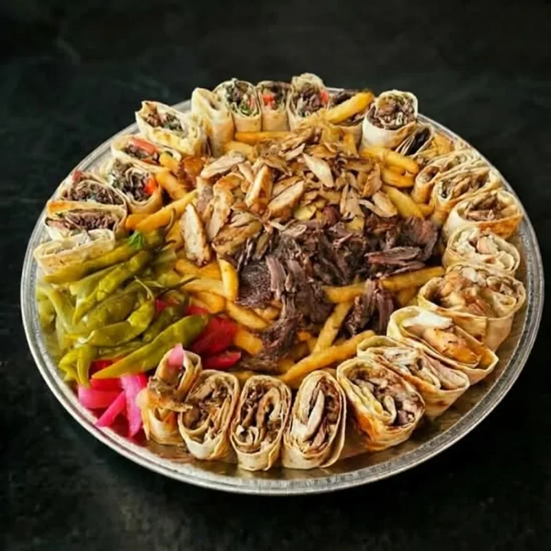 AL CHICK fusion platter with shawarma wraps, chicken, beef, fries and pickled vegetables